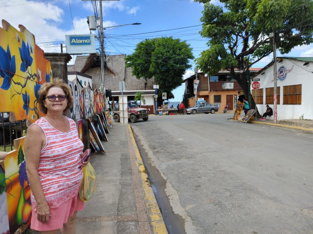 Photo of Pam in a beach town.