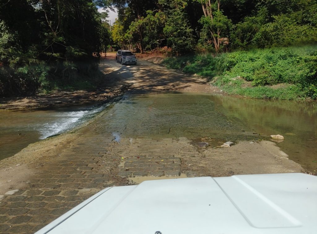 Road and creek intersection in a remote area.